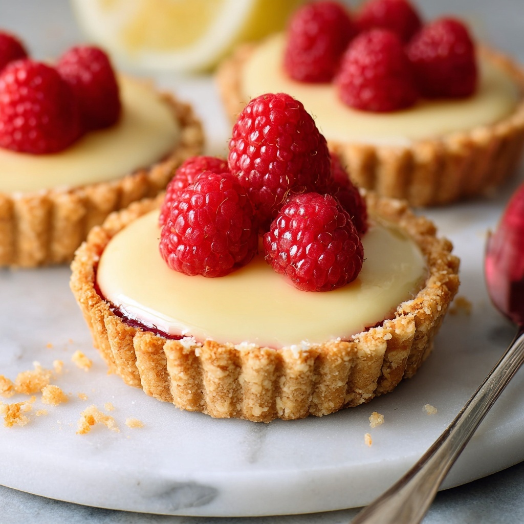 Mini Lemon Tarts with Raspberry Jam and Fresh Raspberries Recipe - Recipe Image